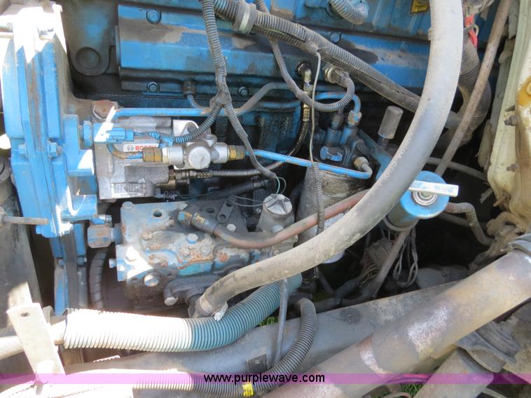 image for item B4750 1998 International 4700 flatbed truck