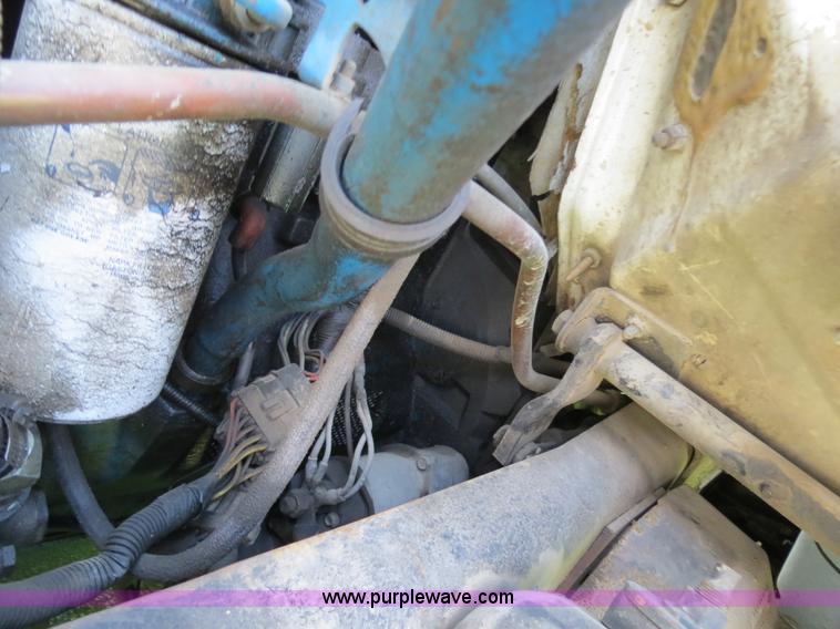 image for item B4750 1998 International 4700 flatbed truck