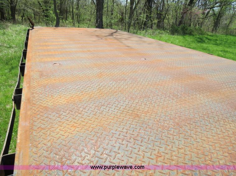 image for item B4750 1998 International 4700 flatbed truck