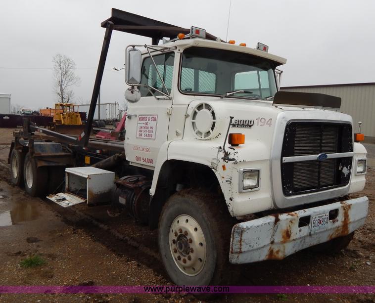 image for item G3117 1988 Ford L8000 roll off truck