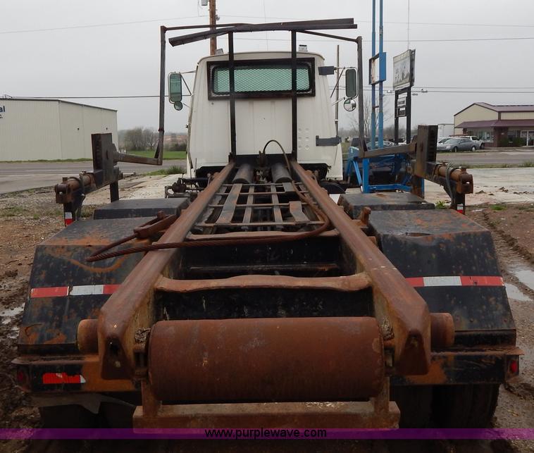 image for item G3117 1988 Ford L8000 roll off truck