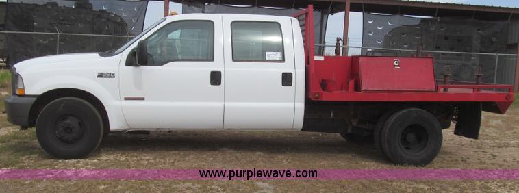 image for item G5683 2004 Ford F350 XL Crew Cab flatbed truck
