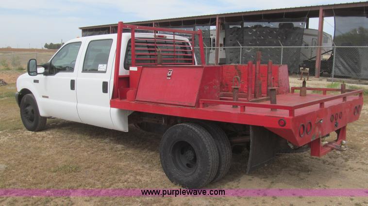 image for item G5683 2004 Ford F350 XL Crew Cab flatbed truck