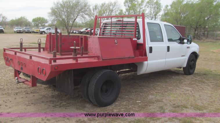 image for item G5683 2004 Ford F350 XL Crew Cab flatbed truck