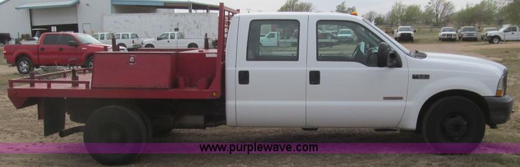 image for item G5683 2004 Ford F350 XL Crew Cab flatbed truck