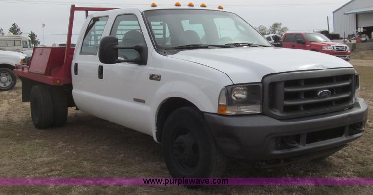 image for item G5683 2004 Ford F350 XL Crew Cab flatbed truck