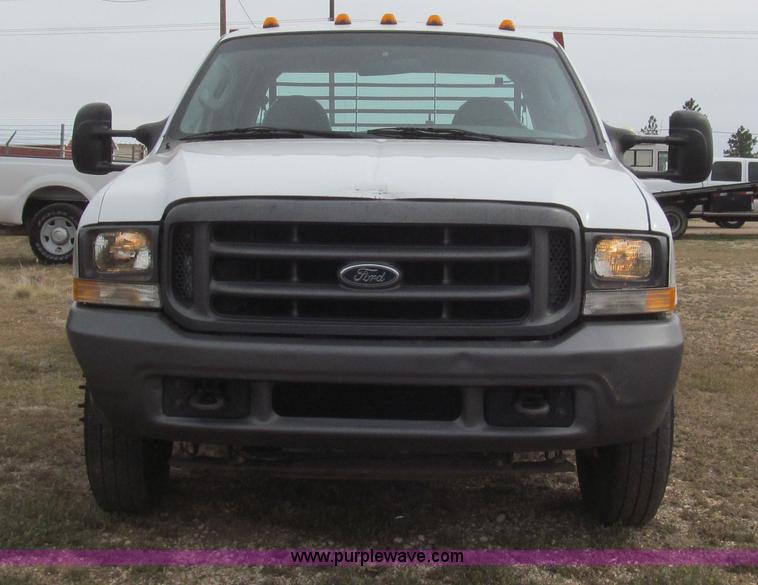 image for item G5683 2004 Ford F350 XL Crew Cab flatbed truck