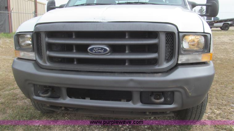 image for item G5683 2004 Ford F350 XL Crew Cab flatbed truck
