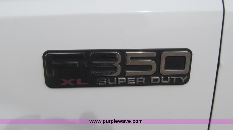 image for item G5683 2004 Ford F350 XL Crew Cab flatbed truck