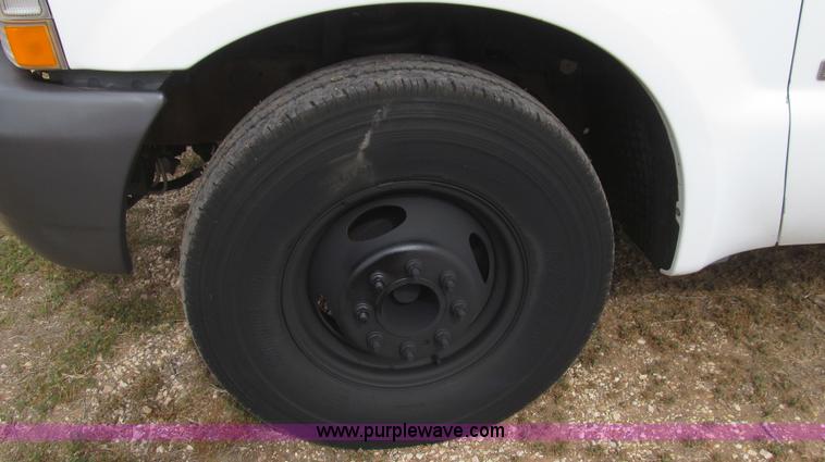 image for item G5683 2004 Ford F350 XL Crew Cab flatbed truck