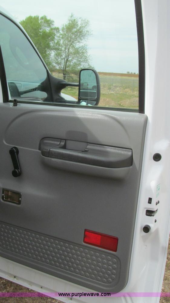 image for item G5683 2004 Ford F350 XL Crew Cab flatbed truck