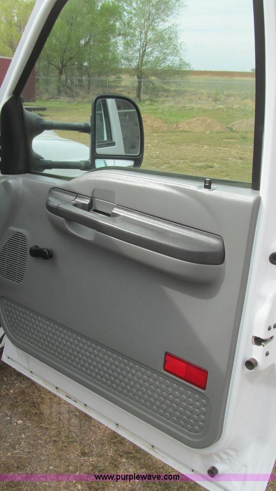 image for item G5683 2004 Ford F350 XL Crew Cab flatbed truck