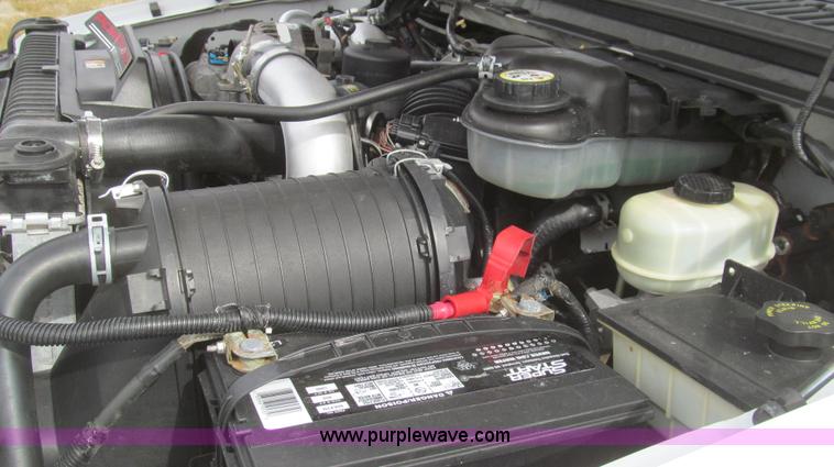 image for item G5683 2004 Ford F350 XL Crew Cab flatbed truck