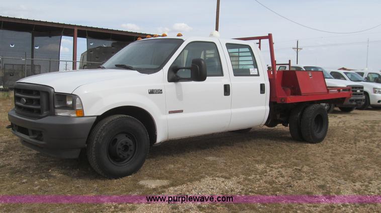image for item G5684 2004 Ford F350 Crew Cab flatbed truck