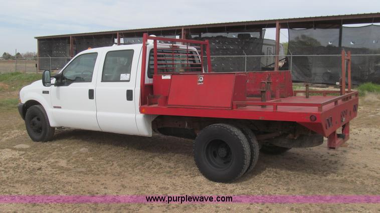 image for item G5684 2004 Ford F350 Crew Cab flatbed truck
