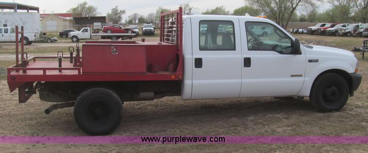 image for item G5684 2004 Ford F350 Crew Cab flatbed truck