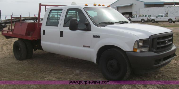 image for item G5684 2004 Ford F350 Crew Cab flatbed truck