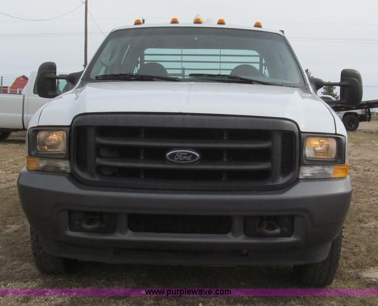 image for item G5684 2004 Ford F350 Crew Cab flatbed truck