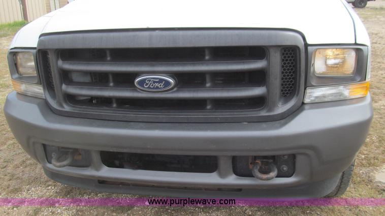 image for item G5684 2004 Ford F350 Crew Cab flatbed truck