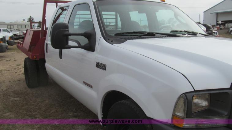 image for item G5684 2004 Ford F350 Crew Cab flatbed truck
