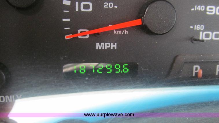 image for item G5684 2004 Ford F350 Crew Cab flatbed truck