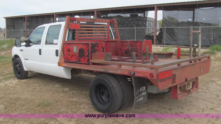 image for item G5685 2006 Ford F350 Crew Cab flatbed truck