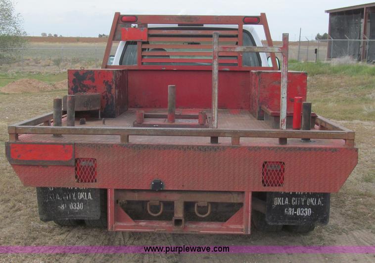 image for item G5685 2006 Ford F350 Crew Cab flatbed truck
