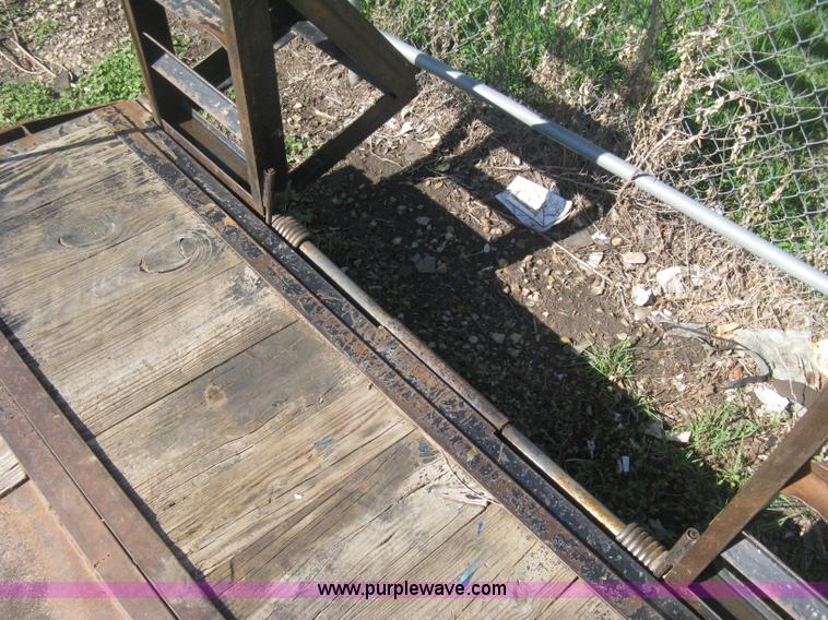 image for item E3381 2004 LB tandem axle flatbed trailer