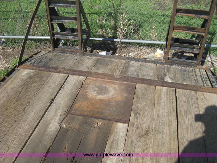 image for item E3381 2004 LB tandem axle flatbed trailer