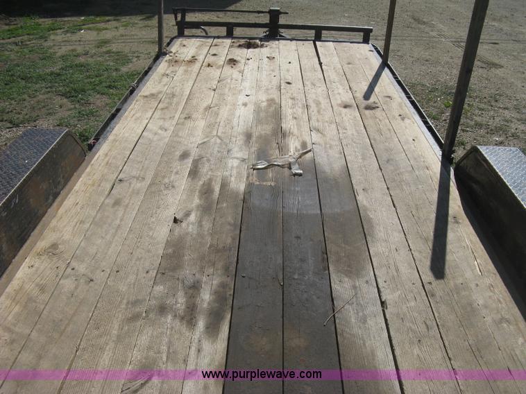 image for item E3381 2004 LB tandem axle flatbed trailer