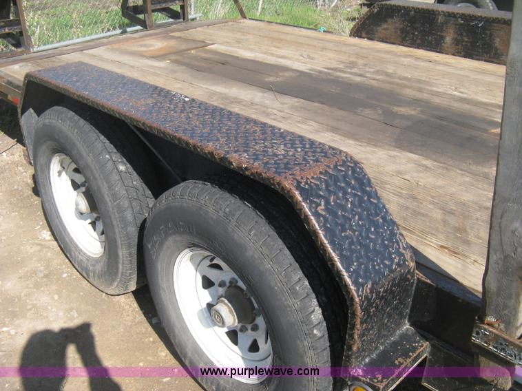 image for item E3381 2004 LB tandem axle flatbed trailer