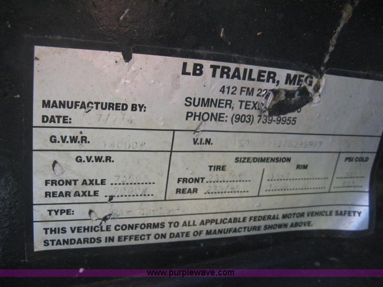 image for item E3381 2004 LB tandem axle flatbed trailer