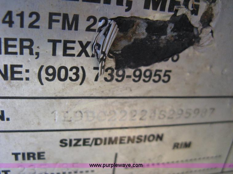 image for item E3381 2004 LB tandem axle flatbed trailer