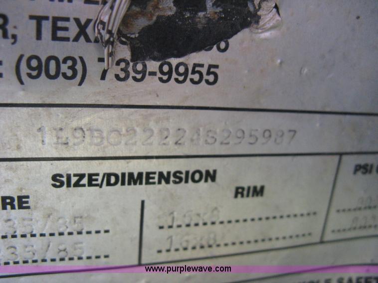 image for item E3381 2004 LB tandem axle flatbed trailer