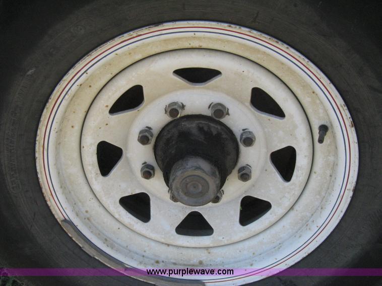 image for item E3381 2004 LB tandem axle flatbed trailer