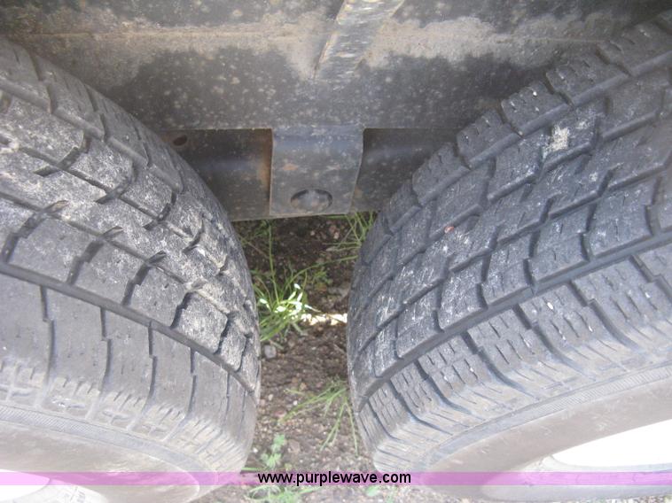 image for item E3381 2004 LB tandem axle flatbed trailer