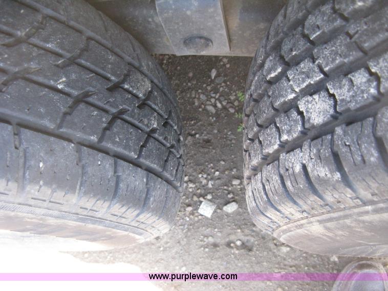 image for item E3381 2004 LB tandem axle flatbed trailer