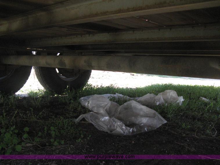 image for item E3381 2004 LB tandem axle flatbed trailer