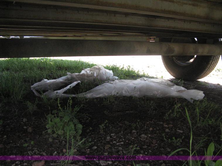 image for item E3381 2004 LB tandem axle flatbed trailer