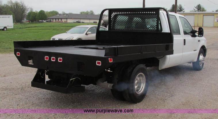 image for item F4825 2000 Ford F350 Super Duty Crew Cab flatbed pickup truck