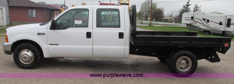 image for item F4825 2000 Ford F350 Super Duty Crew Cab flatbed pickup truck