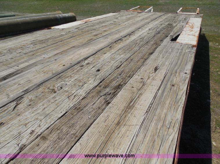 image for item H3243 1982 JFW 20' triple axle flatbed trailer