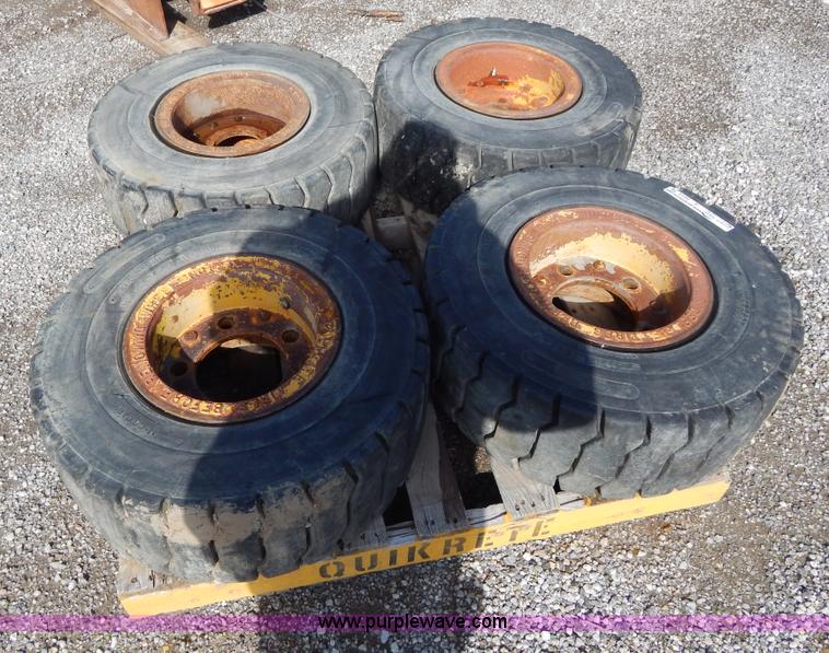 image for item V9914 (4) pneumatic 27 x 10-12 forklift tires