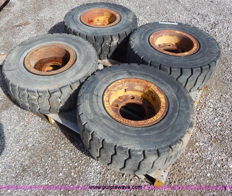 image for item V9914 (4) pneumatic 27 x 10-12 forklift tires