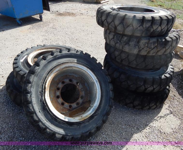 image for item V9915 (8) 8.25-20 solid forklift tires
