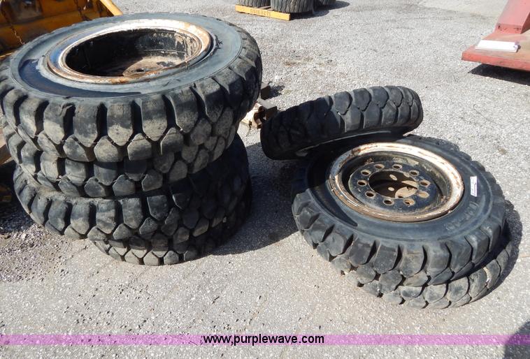 image for item V9915 (8) 8.25-20 solid forklift tires