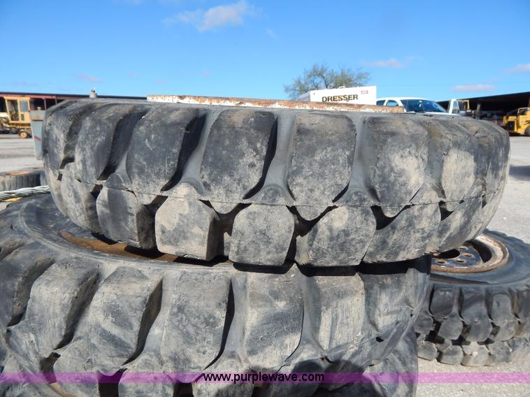 image for item V9915 (8) 8.25-20 solid forklift tires