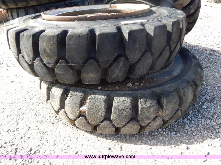 image for item V9915 (8) 8.25-20 solid forklift tires