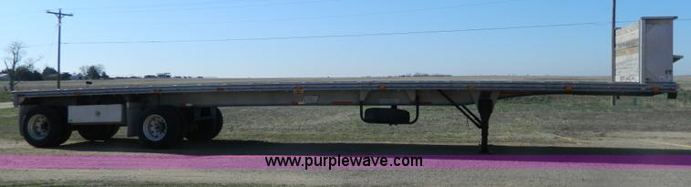 image for item G7829 1990 East aluminum flatbed trailer