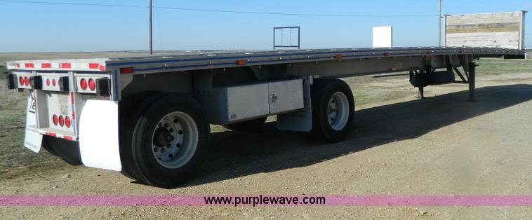 image for item G7829 1990 East aluminum flatbed trailer